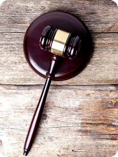 Judge's gavel on a wooden desk