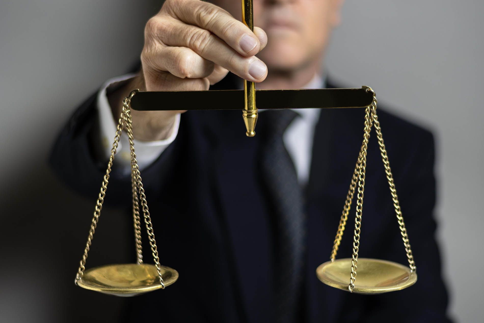 Solicitor holding a set of justice scales